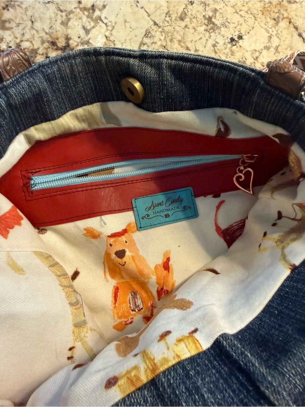 Denim Hobo Bag with Embroidered Accents and Tassel Charm